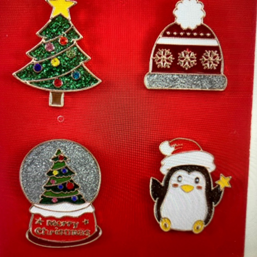 Four Enamel Pins Themed around Christmas